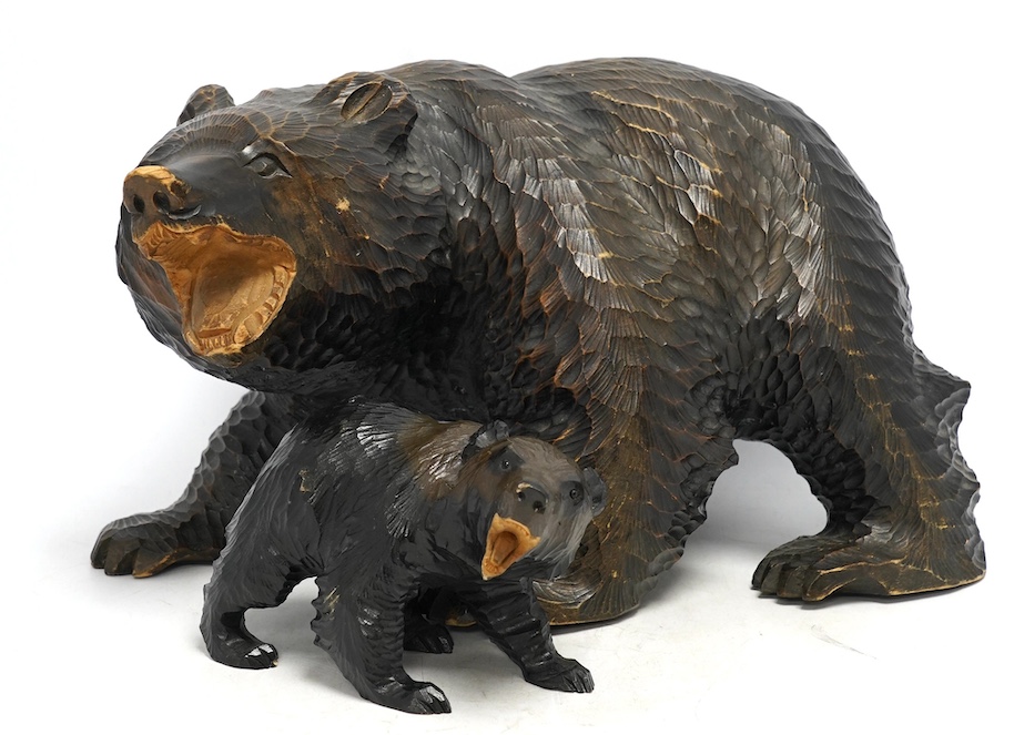 Two Japanese carved wood bears, largest approximately 38cm wide. Condition - poor, some damage